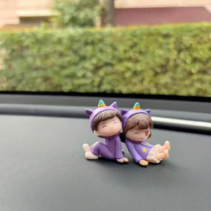 Adorable Couple Miniature Figurines in Purple Unicorn Outfits | Cute Boy & Girl Sitting Pose Showpiece for Car Dashboard, Home Decor, Gifting, Birthday & Anniversary